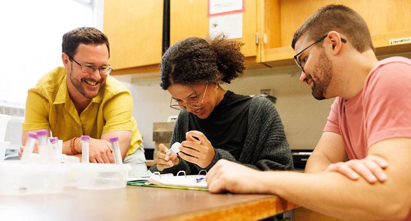 Amélie Mwilambwe, center, has been getting an early start on research in Dr. Ben Sadd's lab. Sadd, right, and Dr. Logan Sauers, left, have been mentoring her through a project for which she received grant support.